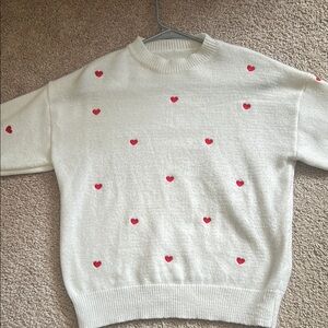 White Sweater with Red Heart Accents